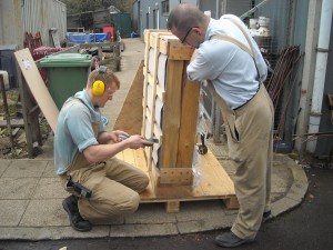 Shaun and Dan unpacking yesterday's delivery of cylinder glass.  
