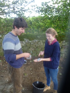 Clara and John diligently obeying Jim’s instruction to ‘look excited’ about the pottery