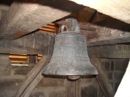 The bell hanging in the belfry. 