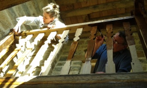 Clara and Jim staining the splats on the landing of the Church's staircase. 